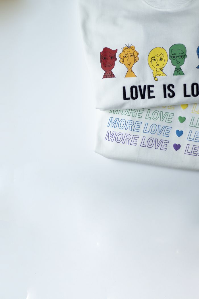 LGBTQ-themed t-shirts featuring diversity and love messages on a white background.